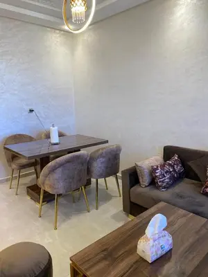 a living room with a couch and a table at pleasant stay in Marrakesh in Marrakech