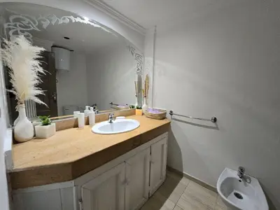 a bathroom with a sink and a mirror at Appartement Moderne Gueliz in Marrakech