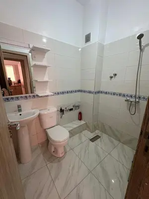 a bathroom with a toilet and a sink at Gueliz modern in Marrakech