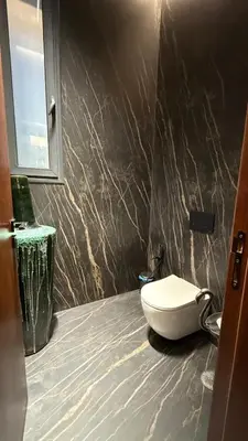 a bathroom with a white toilet in a room at Villa Talya in Marrakech