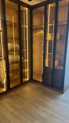 a room with wooden walls and a room with glass doors at Villa Talya in Marrakech
