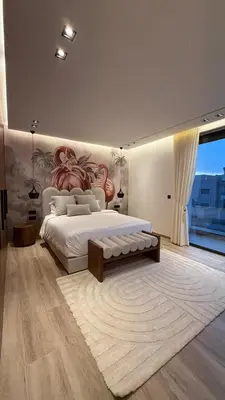 a bedroom with a large bed and a large window at Villa Talya in Marrakech