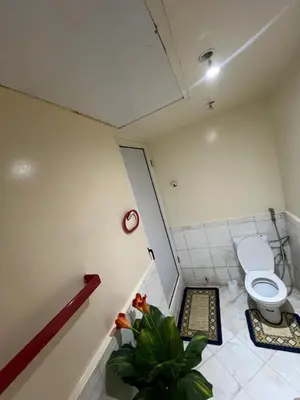 a small bathroom with a toilet and a plant at Atlas feeling in Marrakech