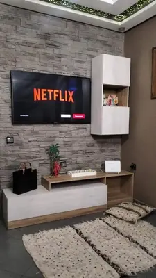 a netflix sign on a brick wall in a room at Bssatin gueliz in Marrakech