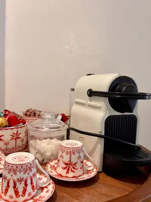 a coffee maker and two cups on a table at Villa Cactus & chill - Breakfast included! in Marrakech