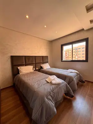 a bedroom with two beds and a window at NEW Marrakech Pool Center - ONLY FAMILY in Marrakech