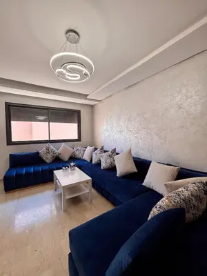 a living room with blue couches and a table at NEW Marrakech Pool Center - ONLY FAMILY in Marrakech