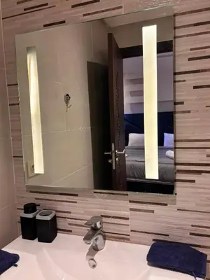 a bathroom with a sink and a large mirror at NEW Marrakech Pool Center - ONLY FAMILY in Marrakech