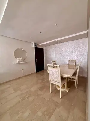 a dining room with a table and chairs and a mirror at NEW Marrakech Pool Center - ONLY FAMILY in Marrakech