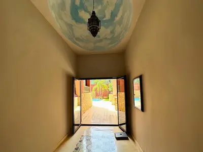 a hallway with a door to a room with a ceiling at Modern Apartment in Centre of Marrakech For Friends & Familie in Marrakech