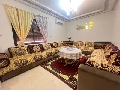 a living room with a couch and a table at Homes 365 Residence Caricia in Marrakech