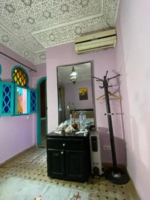 a bathroom with a sink and a mirror at Riad Massin Marrakech in Marrakech