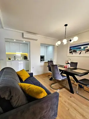 a living room with a couch and a table at Appartement de luxe à Marrakech in Marrakech