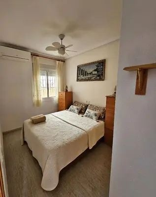 a bedroom with a bed and a ceiling fan at Appartement de luxe à Marrakech in Marrakech