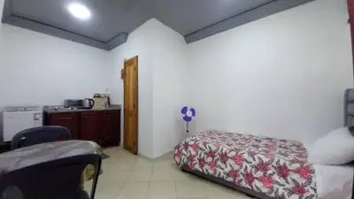 a room with a bed and a kitchen in it at Studio Confortable à Belbekkar, Marrakech in Marrakech