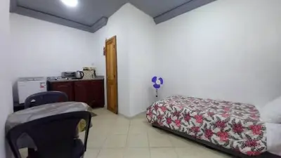 a bedroom with a bed and a table in a room at Studio Confortable à Belbekkar, Marrakech in Marrakech