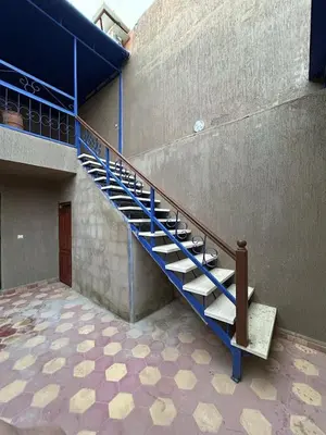 a staircase in the side of a building at Maison d'hôtes Marrakech in Marrakech