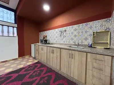 a kitchen with a sink and a counter top at Maison d'hôtes Marrakech in Marrakech