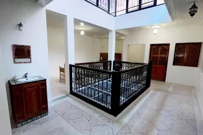 a large room with a staircase in a building at Appartement 3 chambres - Marrakech Belbekkar in Marrakech