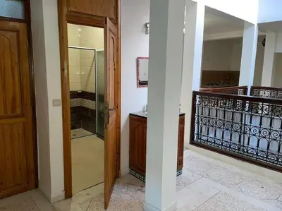 a room with a glass door and a staircase at Appartement 3 chambres - Marrakech Belbekkar in Marrakech