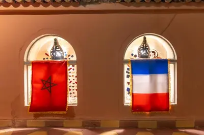 two stained glass windows with the flags of russia and the us flag at Riad Hbibti Authentic Moroccan Stay with Rooftop Jacuzzi in Marrakech