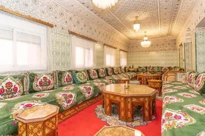 a large room with couch and tables in it at Riad Hbibti Authentic Moroccan Stay with Rooftop Jacuzzi in Marrakech