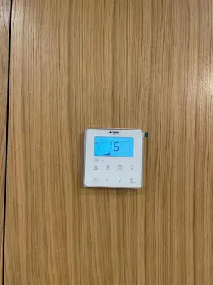 a digital clock on a wooden table at Apartment for rent in Marrakech