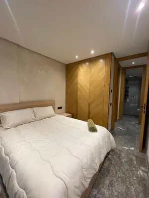 a bedroom with a large white bed in it at Apartment for rent in Marrakech