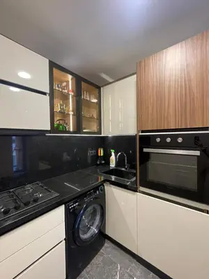 a kitchen with a washing machine and a stove at Apartment for rent in Marrakech
