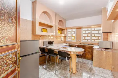 a kitchen with a large island in the middle at Guéliz Marrakech-Authentique, spacieux , central in Marrakech