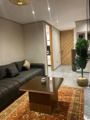 a living room with a couch and a coffee table at Apartment for rent in Marrakech