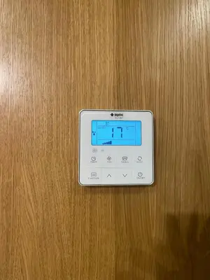 a digital clock on a wooden table at Apartment for rent in Marrakech