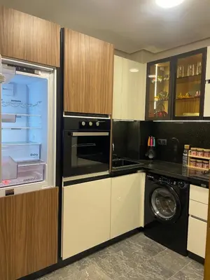 a kitchen with a refrigerator and a washer at Apartment for rent in Marrakech