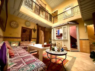 a living room with a couch and a table at Riad Sylvia in Marrakech