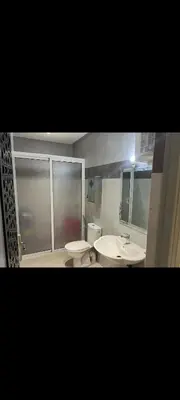 a bathroom with two sinks and a toilet at Chambre Marrakech 3 in Marrakech