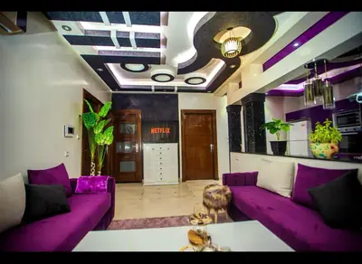 a living room with purple couches and a purple ceiling at Spacious Moroccan Stay, Near Airport in Marrakech