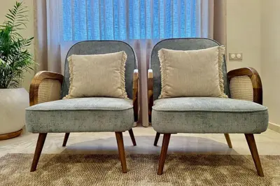 two chairs with pillows in a room with a window at Modern 2-Bedroom Apartment in Agdal with Pool & Terrace in Marrakech