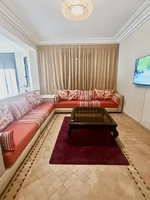a living room with two couches and a coffee table at charming mini villa in Marrakech