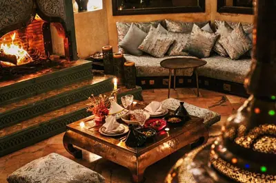 a living room with a couch and a table with a candle at La Villa Wassim in Marrakech