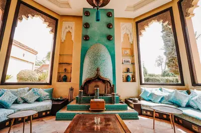 a living room with a couch and a fireplace at La Villa Wassim in Marrakech