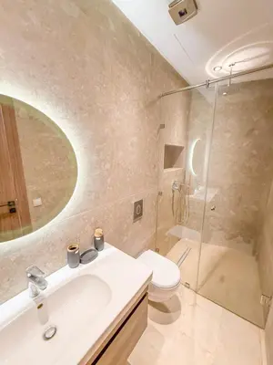 a bathroom with a sink and a toilet and a shower at Modern apartment in Gueliz Luxury residence in Marrakech