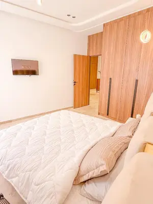 a large white bed in a white room at Modern apartment in Gueliz Luxury residence in Marrakech