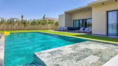 a swimming pool in the backyard of a house at Villa SLIMANE - Villa plain-pied sans vis à vis in Marrakech