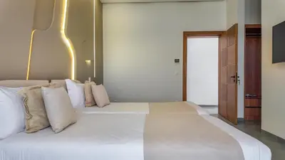 a bedroom with a large bed with white pillows at Villa SLIMANE - Villa plain-pied sans vis à vis in Marrakech