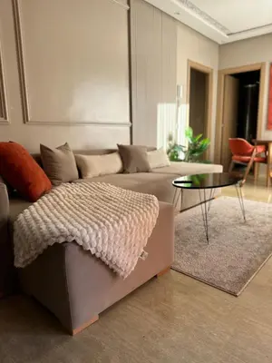 a living room with a couch and a table at Homekesh in Marrakech