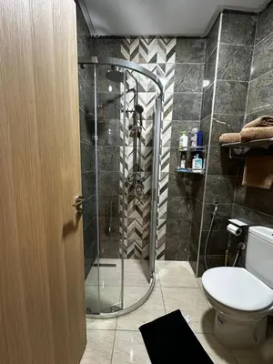 a bathroom with a shower and a toilet at Homekesh in Marrakech