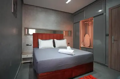 a bedroom with a large bed with white pillows at Dar lalla in Marrakech