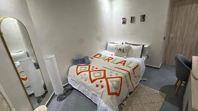 a hospital room with a bed and a mirror at Dar lalla in Marrakech