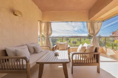 a living room with a couch and a table at Beautiful 3 bedroom apartment for 6 people Prestigia Golf Saphir in Marrakech