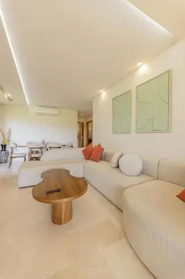 a living room with a couch and a table at Beautiful 3 bedroom apartment for 6 people Prestigia Golf Saphir in Marrakech